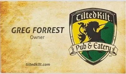 Tilted Kilt Pub and Eatery business card with the shield logo, marked Owner