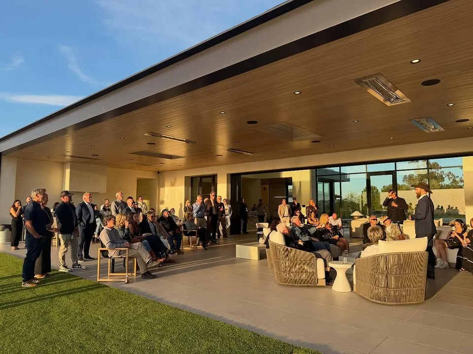 Guests gathered on a terrace at the watch party