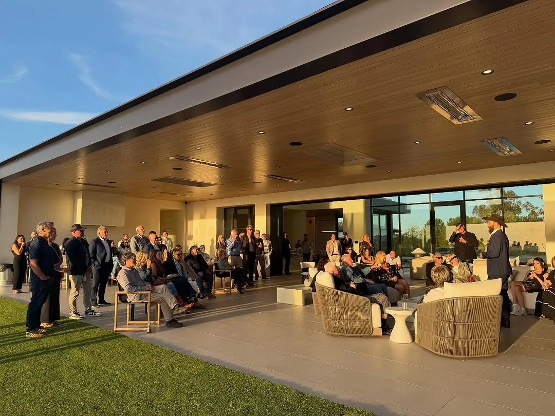 Guests gathered on a terrace at the watch party